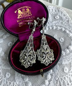 Featuring an absolutely gorgeous pair of antique Art Deco 1920s rhodium plated screw back drop Chandelier earrings adorned with dazzling closed back faceted Diamond paste stones.  Earrings measure approximately 2.5  inches long at 10.52  grams respectively with both pieces in fine antique condition with functional clasps, a nice patina with all stones intact and accounted for.  These beauties are just so sophisticated, beautifully made and ready to wear!!  Please feel free to contact me with any Vintage Formal Filigree Chandelier Earrings, Formal Art Deco Clip-on Earrings, Silver Art Deco Chandelier Earrings For Evening, Vintage Silver Chandelier Earrings For Formal Occasions, Silver Vintage Chandelier Earrings For Formal Occasions, Victorian Silver Clip-on Earrings For Wedding, Silver Victorian Clip-on Earrings For Wedding, Antique Silver Chandelier Earrings For Formal Occasions, Antique Silver Clip-on Earrings For Wedding