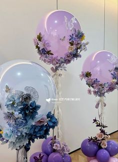 balloons and flowers are on display in front of a mirror