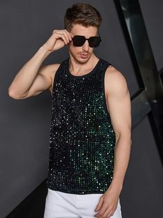 This men's black sequin tank top shirt is a stylish way to make a statement. Crafted with lightweight fabric and eye-catching sequins, it is perfect for dressing up any outfit. Durable stitching ensures a comfortable fit with no sagging. 100% Polyester Pull On closure Hand Wash or Dry Clean Quality polyester material, luxurious and lightweight fabric, soft and comfortable Brand Size Chest Waist S 43.7 40.6 M 45.7 42.5 L 48.7 45.5 XL 51.7 48.5 XXL 54.6 51.5 Sequin Sleeveless Tank Top For Club, Contrast Sequin Tank Top For Night Out In Summer, Contrast Sequin Tank Top For Summer Night Out, Contrast Sequin Tank Top For Summer Nights, Sleeveless Contrast Sequin Top For Night Out, Summer Party Tank Vest, Stretch Sequined Tank Top, Summer Tank Top With Contrast Sequin For Night Out, Fitted Sequined Tank Top For Summer