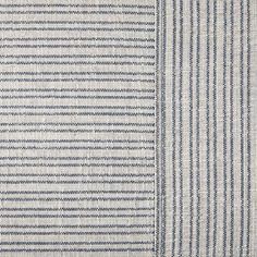 an upholstered blue and white striped fabric