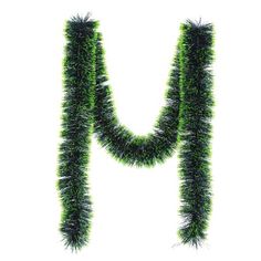 the letter m is made up of green grass