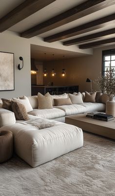 a living room filled with lots of white furniture