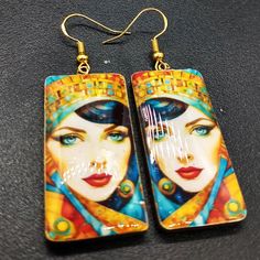 These image transfer earrings are ready to ship.  The earrings are handcrafted from polymer clay and uses my own image transfer technique. They have a top layer of resin. Bohemian Gold Resin Earrings, Bohemian Resin Earrings With Ear Wire, Bohemian Resin Earrings As Gift, Artsy Enamel Drop Earrings, Unique Hand Painted Earrings For Gift, Bohemian Resin Drop Earrings, Handmade Artsy Resin Earrings, Hand Painted Resin Earrings For Gifts, Artistic Hand Painted Polymer Clay Earrings