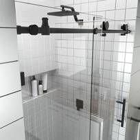 a bathroom with a glass shower door and tiled walls