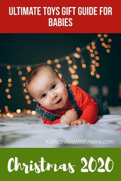 a baby laying on top of a bed with christmas lights in the background and text overlay