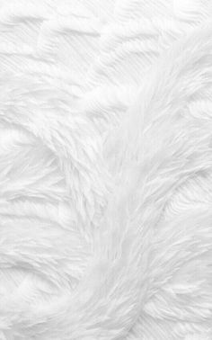 the white fur texture is very soft and fluffy, but it doesn't look like any