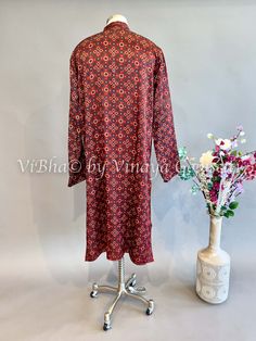 Expertly crafted from high-quality Maroon Gaji Silk, this kurta is a must-have for any fashion-forward individual. The luxurious material offers a comfortable fit while exuding a sense of elegance and sophistication. Perfect for any occasion, this kurta is the epitome of style and versatility. Designer Long Sleeve Cotton Silk Kurta, Festive Fall Kurta With Printed Motifs, Traditional Cotton Silk Tunic Kurta, Festive Printed Kurta For Fall, Festive Cotton Silk Kurta With Long Sleeves, Festive Cotton Silk Long Sleeve Kurta, Festive Long Sleeve Cotton Silk Kurta, Winter Cotton Kurta With Printed Motifs, Winter Kurta With Printed Motifs