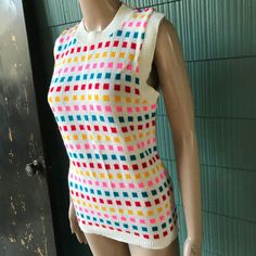 "Fantastic vintage 60's/70's mod colorful square pattern knit sleeveless sweater top. Longer fit, but can be tucked in nicely. 100% acrylic. In good vintage condition. Made by RJ Pumpkin. Will best fit medium. Measurements laying flat: fabric stretches Armpit to armpit: 18\" Length: 25\"" Multicolor Fitted Retro Tank Top, Retro Multicolor Cotton Vest, Retro Multicolor Sleeveless Vest, Retro Multicolor Summer Vest, Multicolor Retro Summer Vest, White Fitted Retro Sweater Vest, Vintage Multicolor Sleeveless Sweater Vest, Retro Cotton Sweater Vest, Retro Cotton Sleeveless Sweater Vest