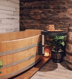 two wooden barrels sitting next to each other on top of a floor near a table