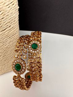 Green Stone CZ  Bangles It comes as a Pair (2 Bangles). Premium quality and craftmanship. Satisfaction Guaranteed. Please measure your size before ordering as we don't accept returns. Starting size we have is 2.4. We don't carry size 2.2. If you have any questions please let me know. Thank You!! Ad Bangles, Green Bangles, Cz Bangles, Traditional Bangles, Indian Bangles, Bangles Indian, Green Stones, Stone Bangle, Bangles Jewelry Designs