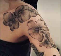 a woman's arm with flowers on it