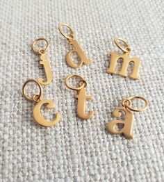 24K satin gold plated sterling silver typerwriter lowercase letter charms 5mm soldered ring Typewriter Letters, Lowercase Letter, Letter Jewelry, Letter Charm, Gold Initial, Letter Charms, Letter Pendants, Initial Charm, Typewriter