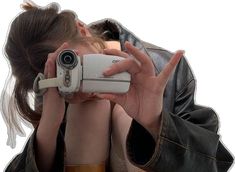 a woman holding a camera up to her face