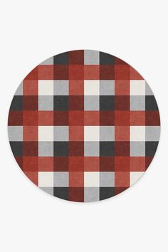 an oval rug with red and grey plaid pattern on the side, it is in front of a white background