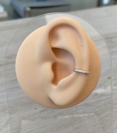 a fake ear with a ring on top of it