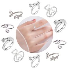 an assortment of rings with cats on them in various shapes and sizes, including one for the