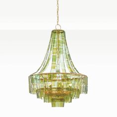 a green chandelier hanging from a gold chain