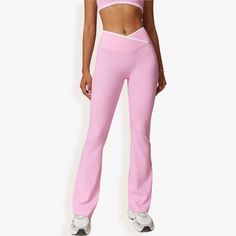 Elevate your workout or casual look with the Anna-Kaci Women's High Waist Crisscross Yoga Pants. These stylish yoga pants feature a flattering crisscross waistband design that enhances your silhouette while offering secure support. The soft, stretchy fabric allows for ease of movement, making them perfect for yoga sessions, gym workouts, or casual outings. The flare leg adds a trendy touch to these versatile pants, easily paired with crop tops, sports bras, or casual tees. Designed for both comf Waistband Design, Flare Yoga Pants, Bottom Workout, Casual Tees, High Waist Yoga Pants, Flare Leg Pants, Yoga Session, Flare Leggings, Bottom Clothes