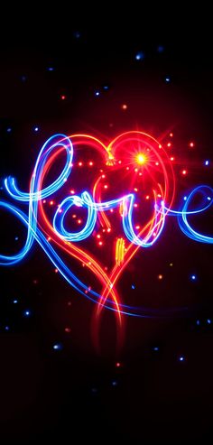 the word love spelled with neon lights in the shape of a heart on a black background