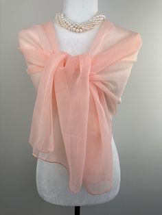 Measures 20"Wx65'"L rectangular scarf.  Poly chiffon sheer transparent scarf. Suitable for size Small and Medium as a shawl. Beautiful translucent scarf for Fall and Spring fashion. This fashionable versatile sheer chiffon shawl can be used to dress up an outfit for a special evening, a wedding or as a neck scarf. Effortlessly give a dress a new look by simply adding this shawl. Perfect as bridesmaid gifts or wedding favours, the perfect gift for any occasion. Mix and match with similar or contrast color jewelry, soaps, hand lotions or a box of chocolates and make the perfect personalized gift pack. Perfect as wedding coverup, bridesmaids gifts. The color is very close however is not exact. Ihave  tried to to capture the color as close as possible to its true color. If you are trying to ma Sheer Shawl Over Dress, Shawl Over Dress, Peach Fashion, Scarf Flower, Salmon Peach, A Box Of Chocolates, Box Of Chocolates, Chiffon Shawl, Color Jewelry