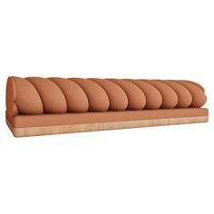 an orange couch sitting on top of a wooden shelf