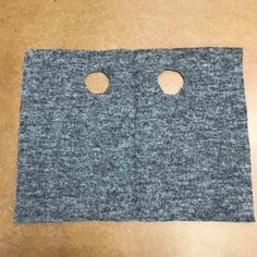 two holes in the side of a piece of felt