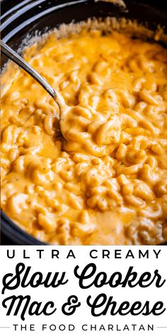 the creamy slow cooker macaroni and cheese is being stirred with a spoon