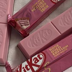 three bars of pink chocolate sitting next to each other