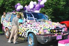 a truck decorated with balloons and streamers