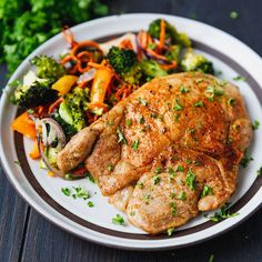 a white plate topped with meat and veggies