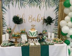 a baby shower party with green and gold decorations