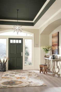 a room with a blue door and rug on the floor