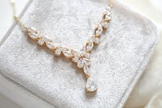 Ultra feminine with no shortage of sparkle, our Simple rose gold bridal necklace is perfect for adding a touch of glamour to your bridal look. Crafted with cubic zirconia stones, this necklace will become a forever favorite. - Created with Premium Cubic Zirconia stones- Available in rose gold, yellow gold, and rhodium finish.- Necklace measures 16 inches and extends to 18 inches- Decorative portion measures 3 inches- Decorative center drop measures 1.2 inches- Nickel free and hypoallergenic- PLE Rose Gold Diamond Cut Necklace For Wedding, Classic Rose Gold Necklaces For Wedding, Gold Diamond Cut Necklace For Wedding, Classic Rose Gold Necklace For Wedding, Classic Gold Crystal Bridal Necklace, Wedding Diamond Cut Necklace, Rose Gold Wedding Necklace With Elegant Design, Classic Wedding Necklace With Cubic Zirconia, Elegant Rose Gold Necklace For Mother Of The Bride