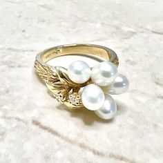 14K Gold Vintage Pearl And Diamond Ring - 14K Yellow Gold Pearl Ring - June Birthstone Ring - Pearl Cocktail Ring - Birthday Gift For Her A beautiful 14 Karat yellow gold cocktail ring set with 5 white cultured pearls, and 2 single cut diamonds weighing approximately 0.06 carat. G-H color VS clarity.  Size 6.75 US / N UK / 53 1/2 FR. > Ring sizing not included.  This ring can be sized to fit most fingers.  If you need to size this ring, please contact us before placing the order. Sized rings are Pearl Cocktail Ring, Smoky Quartz Jewelry, Yellow Gold Cocktail Ring, June Birthstone Ring, Ring Pearl, Gold Pearl Ring, Pearl And Diamond Ring, Jewelry Appraisal, Gold Cocktail