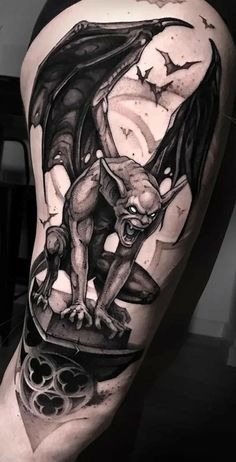 a black and white tattoo with a bat on it