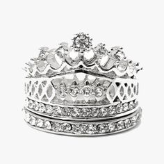 Look and feel like royalty wearing this elegant Imperial Crown Ring Set. Simply wear this set, and you'll have all the accessories you need to turn your ensemble around. With a touch of class and pretty, this piece is sure to brighten your style. You'll simply adore how it sparkles and makes you feel absolutely lavish Elegant Wedding Crystal Ring, Elegant Metal Stackable Rings, Silver Stackable Rings For Party, Elegant Metal Crystal Ring With Bling, Dazzling Silver Stackable Rings, Elegant Crystal Ring With Bling, Elegant Metal Crystal Ring With Rhinestones, Elegant Metal Rings With Sparkling Stones, Silver Rhinestone Ring Jewelry