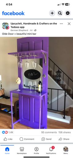 a purple bar with wine glasses on it and a sign that says facebook upcyclist, handmade & crafts on the front