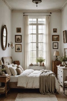 a bedroom with white walls and wooden floors