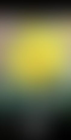 an abstract blurry background with yellow and green colors on the left, black bottom