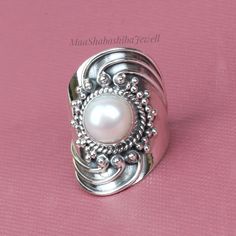 "Natural Pearl Ring, Wide Band Ring, 925 Sterling Silver Ring, Handmade Filigree Ring, Fresh Water Pearl Jewelry, Gift For Her, Wedding Ring SHOP LINK:- https://www.etsy.com/shop/MaaShabashibaJewell?ref=seller-platform-mcnav 》D E T A I L S《 Gemstone: Natural Pearl Gem Color: White Stone Shape: Round Metal: 925 Sterling Silver Purity: 925 Parts Per 1000 Setting Type: Prong Set Silver Polish: High Ring Size: All Size Available Please note that there Can be slight variations in stone texture and co White Open Ring Stamped 925, White Stamped 925 Open Ring, Wedding Pearl Ring Stamped 925 In Sterling Silver, Wedding Pearl Ring In Sterling Silver, White Sterling Silver Pearl Ring, White Pearl Sterling Silver Ring, Unique Sterling Silver Pearl Ring For Wedding, Handmade White Toe Ring, Silver Sterling Silver Pearl Ring For Wedding