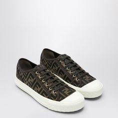 FF jacquard patterned fabric sneaker in brown and tobacco tones by Fendi, with white rubber sole and logo on the back, round toe and lace-up closure. - Size Type: UKMaterial: CottonSKU: 7E1553AJZX/P_FENDI-F0R7V_604 Our Products Are 100% Genuine. In All Cases We Stand By The Authenticity Of Every Product Sold On Our Site.