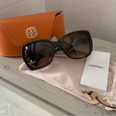 Tory Burch Sunglasses Leather Case W/ Magnetic Closure & Dust Bag Shape: Rectangle Gender: Female Material: Acetate Bridge Type: Full Rim Color Description: Black Frame Color: Black Lens Color: Brown Gradient Eye/Bridge/Temple 55/18/135 Tory Burch Sunglasses, Sunglasses Logo, Uv Sunglasses, Butterfly Sunglasses, Brown Gradient, Rectangular Sunglasses, Rectangle Sunglasses, Orange Leather, Gold Sunglasses