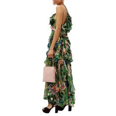 Ornamental green silk-crepe gown, capturing the Gucci's talent for richly textured and patterned eveningwear. Depicting contrasting florals, graphic checks and the house's signature logo lettering, it's crafted in Italy to a retro halterneck silhouette and imbued with cascading layers of ruffled panels to create elegant movement. Color: green100% SilkMade in Italy Gucci Maxi Party Dress, Gucci Formal Maxi Length Dress, Gucci Maxi Length Party Dresses, Gucci Maxi Dress For Party, Gucci Formal Maxi Dress, Gucci Elegant Evening Maxi Dress, Gucci Evening Maxi Dress, Elegant Gucci Evening Maxi Dress, Designer Silk Green Dresses