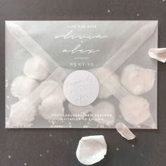 an envelope with white candies in it