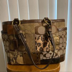 Unique Brown Patterned Coach Bag Dark Brown Interior Few Minor Wear And Tear But Nothing Too Noticeable Height: 14 Inches Width: 8.5 Inches Coach Brown Bucket Shoulder Bag, Brown Coach Bucket Shoulder Bag, Brown Bucket Bag With Branded Hardware, Brown Tote Bag With Branded Hardware, Dark Brown Interior, Wine Mom, Bag Dark, Brown Interior, Clothing Designs