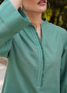 This teal green co-ord set has a straight-cut shirt with delicate lace along the neckline and matching trousers - all made along cross-hatch Color: Teal Green​Fabric: Cross Hatch Fabric Cross, Cut Shirt, Indian Fashion Dresses, Co Ord Set, Cut Shirts, Green Fabric, Kurti Designs, Co Ord