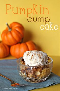 pumpkin dump cake in a glass bowl on top of a blue napkin