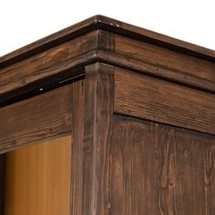 a close up view of the corner of a wooden cabinet