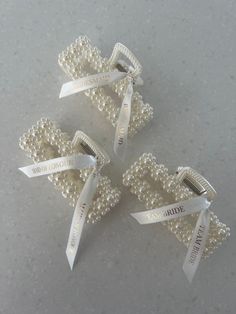 three wedding hair clips with ribbons and pearls