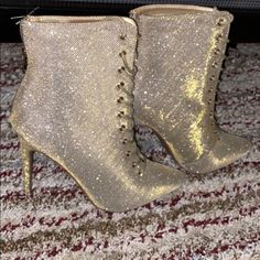 Shimmery Gold Booties. Back In Stock. Glamorous Gold Ankle Boot Heels, Spring Party Booties With Almond Toe, Glamorous Party Booties With Round Toe, Gold Closed Toe Boots For Party, Chic Lace-up Party Booties, Glamorous High Heel Party Booties, Party Lace-up Winter Booties, Winter Party Lace-up Booties, Spring Party Booties With Round Toe